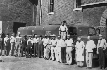 Kentucky Peerless Distilling employees. Far right is the Master Distiller–Walter "Bix" Herman Bixler (1886-1958)